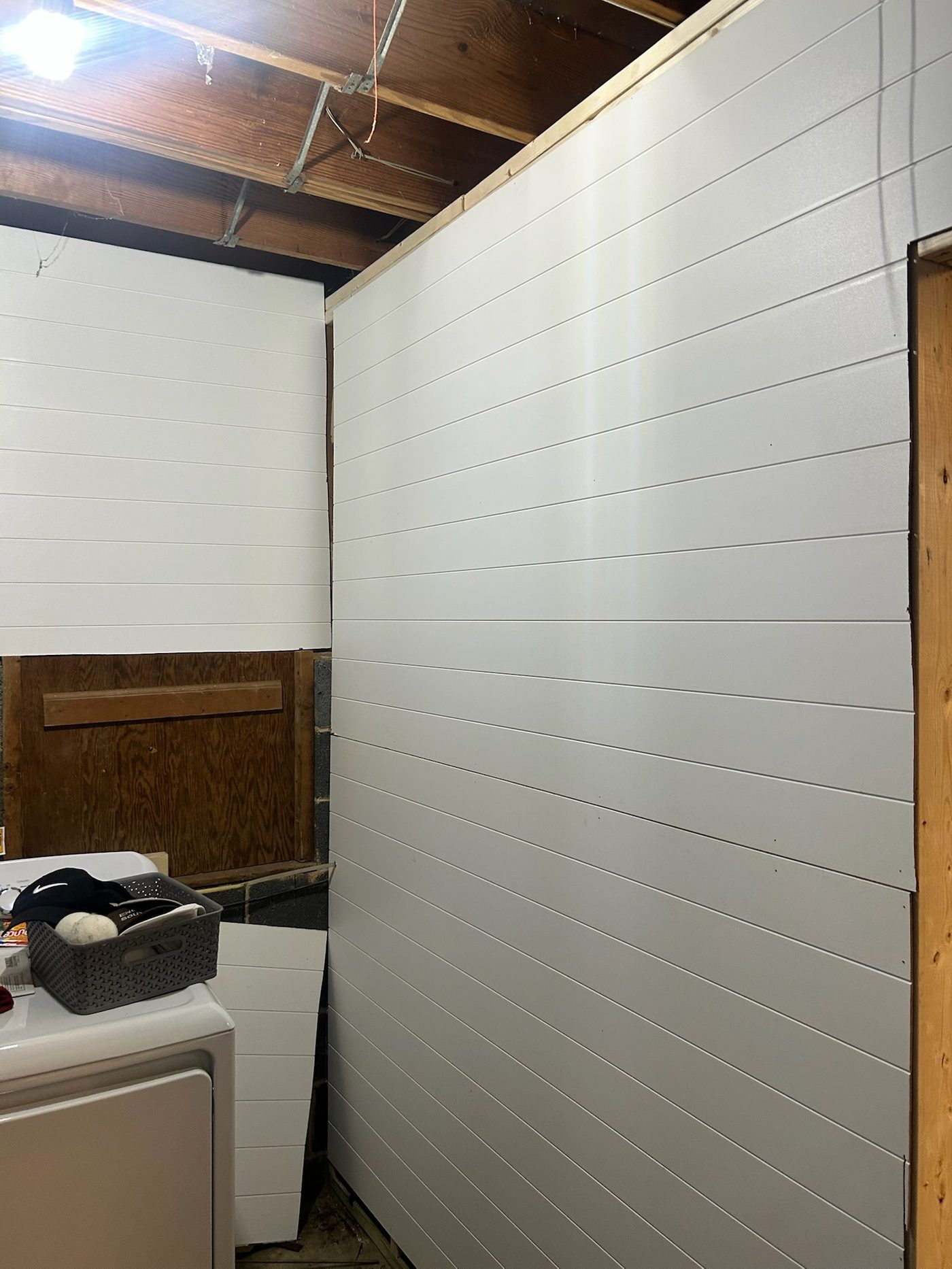 White shiplap laundry room renovation