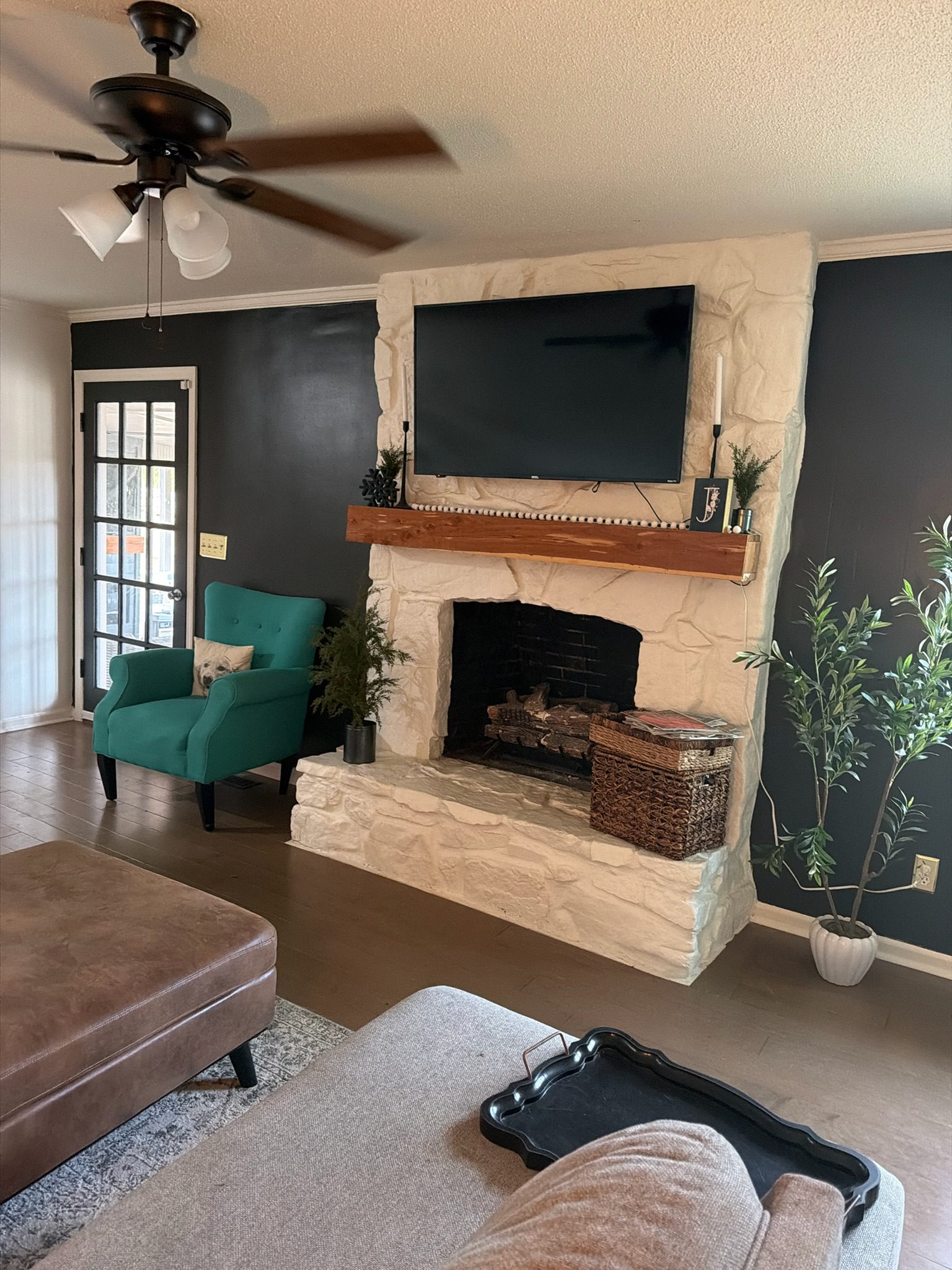 Living room with stone fireplace